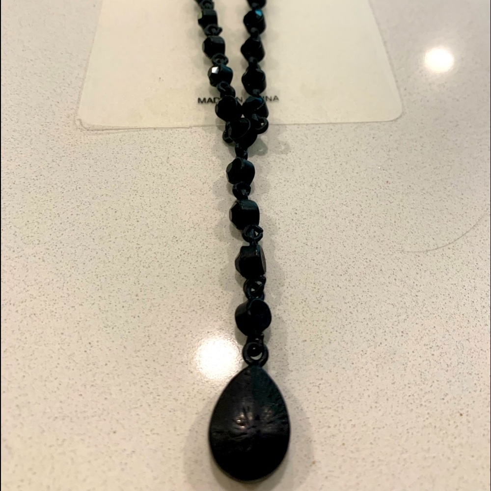 Matching black necklace and earrings